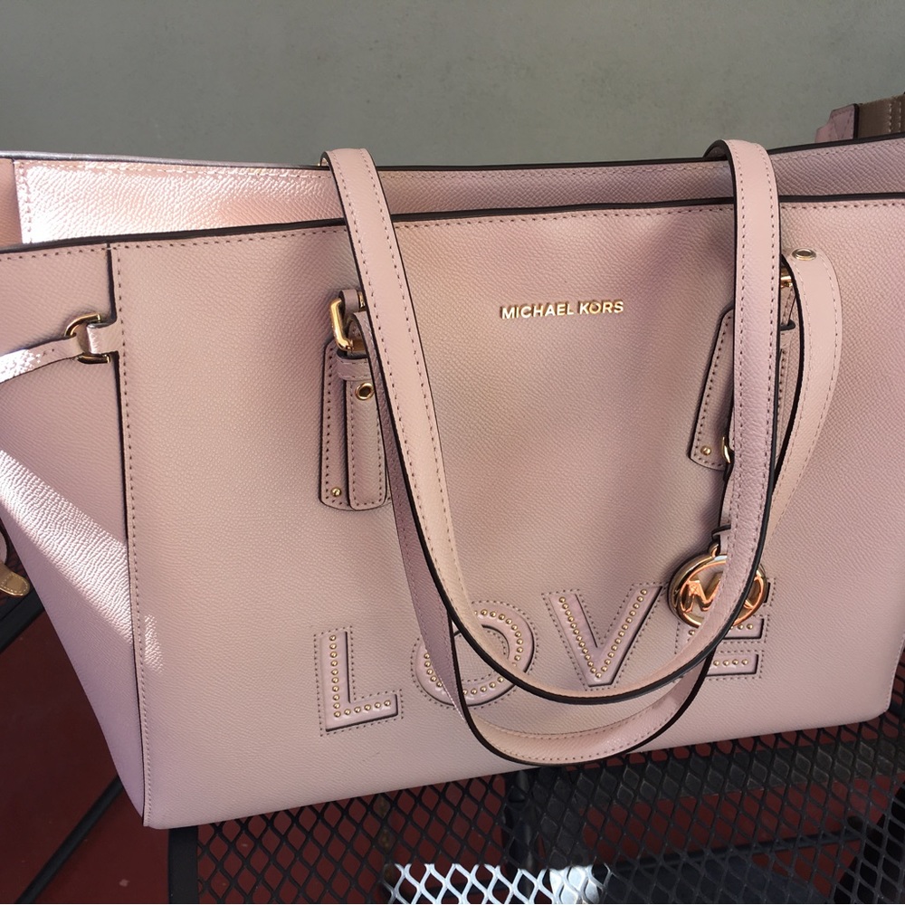 Michael Kors genuine leather tote bag from “Love” collection